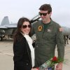 Lindsay Madrigal greets returning VFA 25 aviator Wes Perkins.